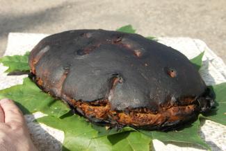 Dark rye bread on Latvian linen tablecloth.